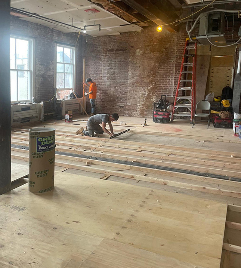 Pre-Qualified Builders – Vetted NYC Renovation Contractors Architect and builder reviewing construction work on site during renovation