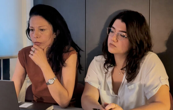 Architect Lenka Ilic and Project Manager Tea reviewing an apartment renovation timeline and drawings for a NYC co-op
