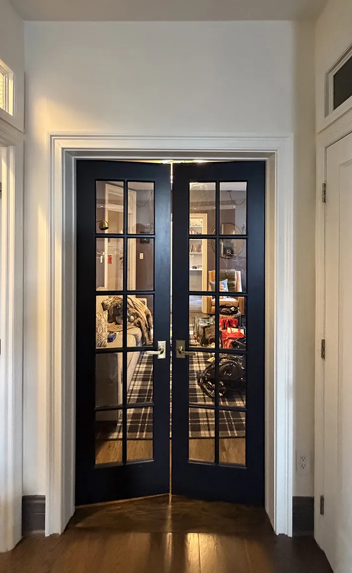 Interior connecting entryway between adjoining co-op apartments at 261 West 22nd Street in Chelsea, Manhattan, illustrating the apartment combination layout.