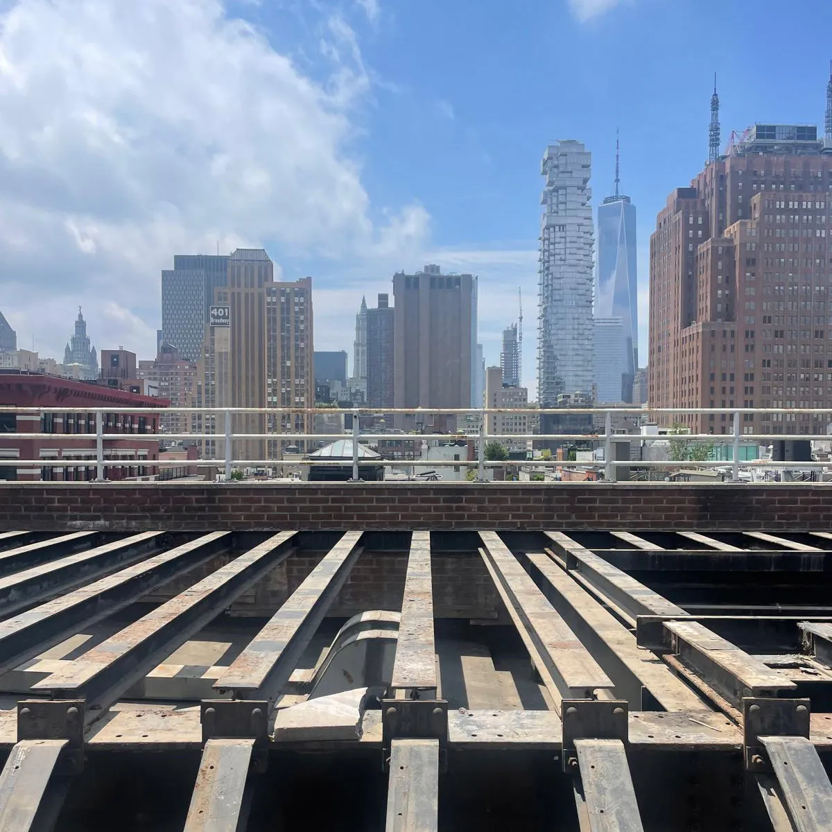 Steel framing for a penthouse roof deck at 47 Mercer Street in SoHo, overlooking the Manhattan skyline.