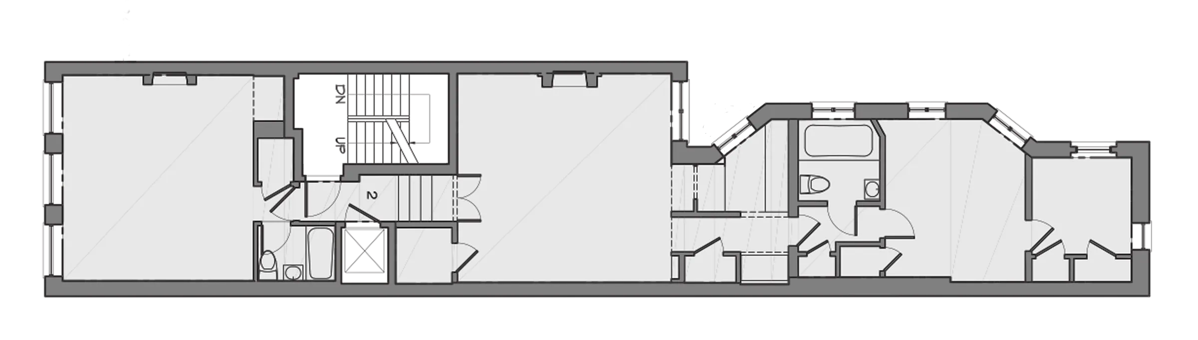 Existing floor plan of an Upper East Side townhouse floor before the brownstone renovation, with the stair hall, bathrooms and rear rooms