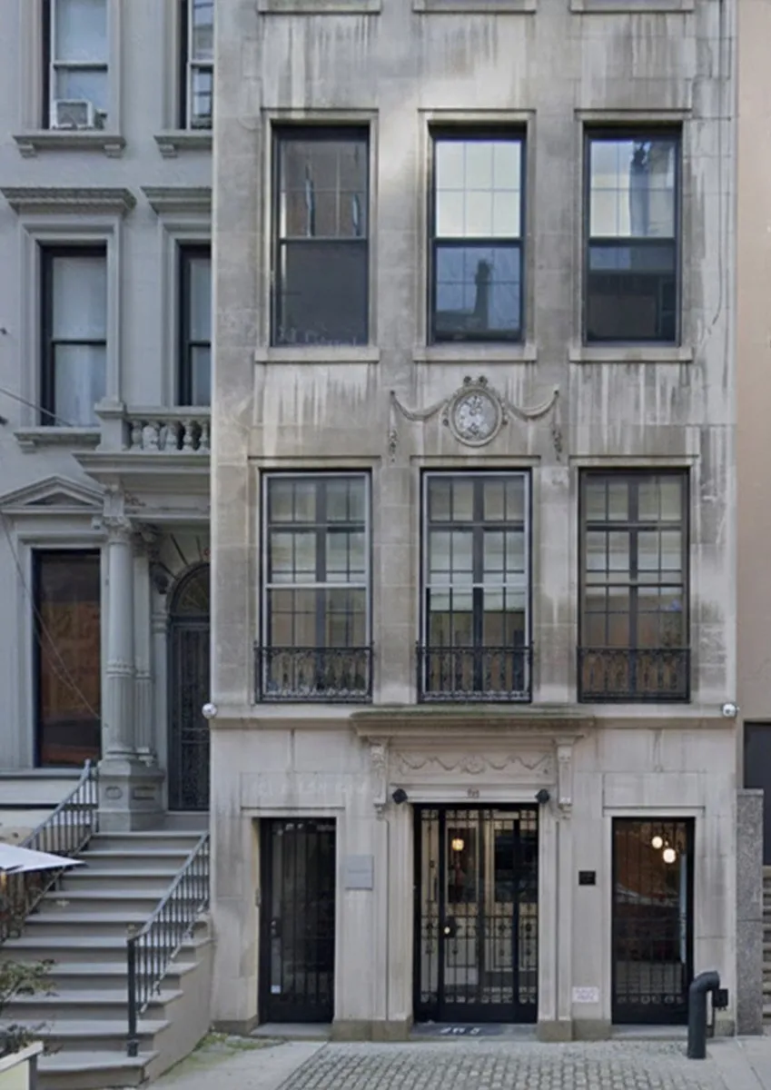 Brownstone renovation building type, an Upper West Side townhouse with a limestone facade, stoop, iron entry doors and tall windows
