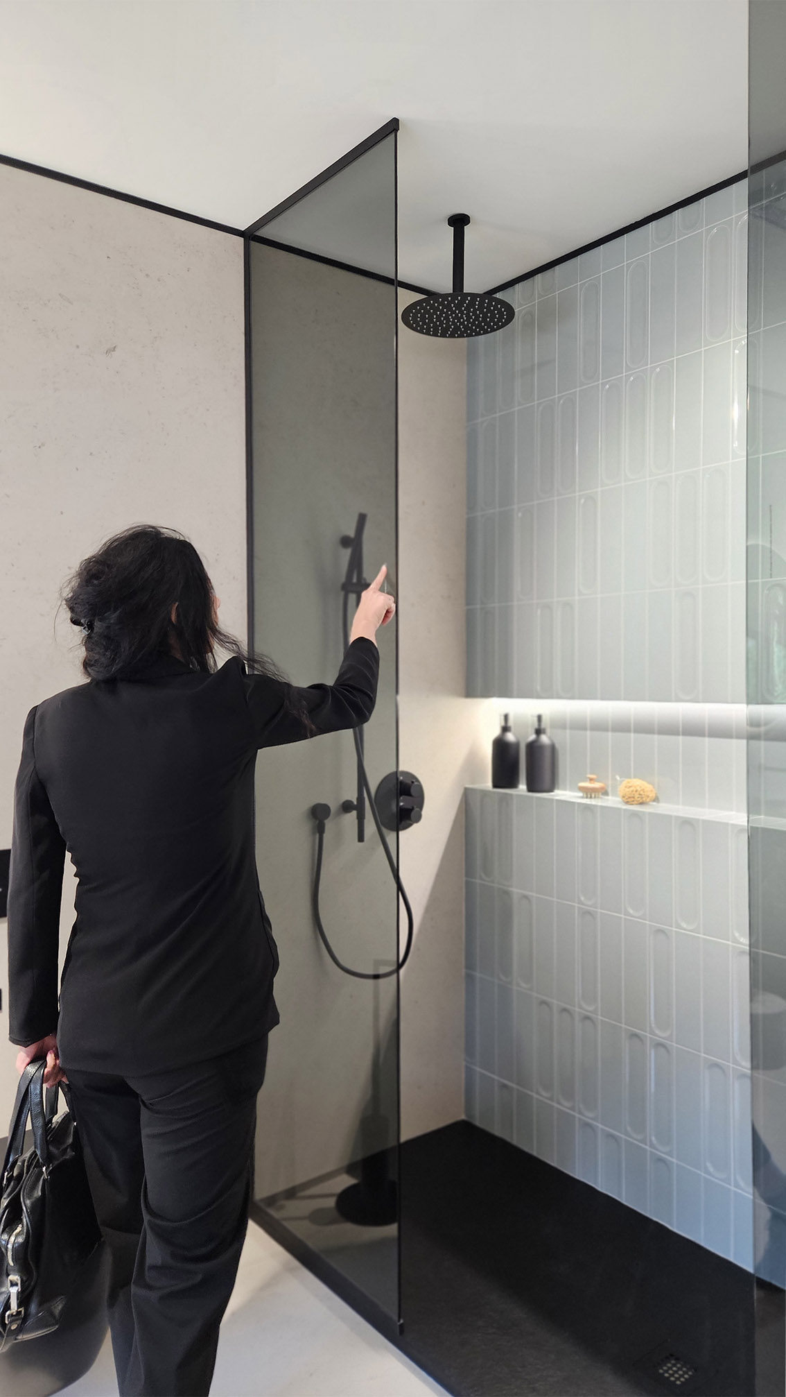 Walk-in shower with black fixtures