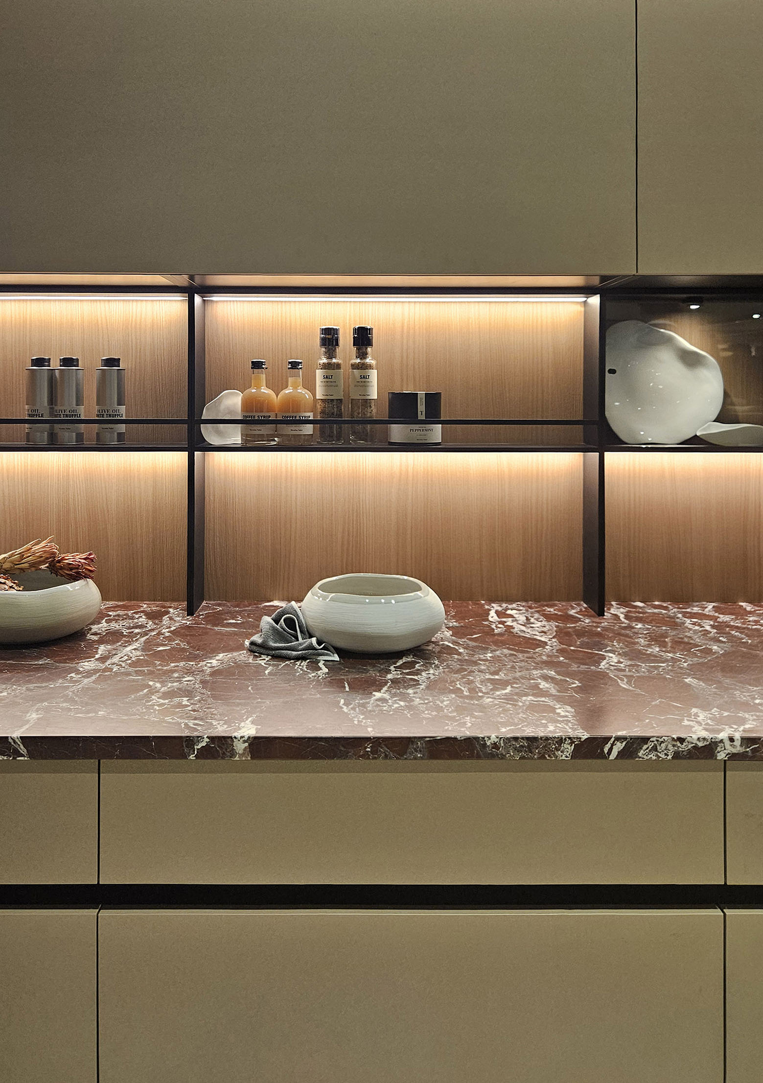 Kitchen with marble countertop and shelving